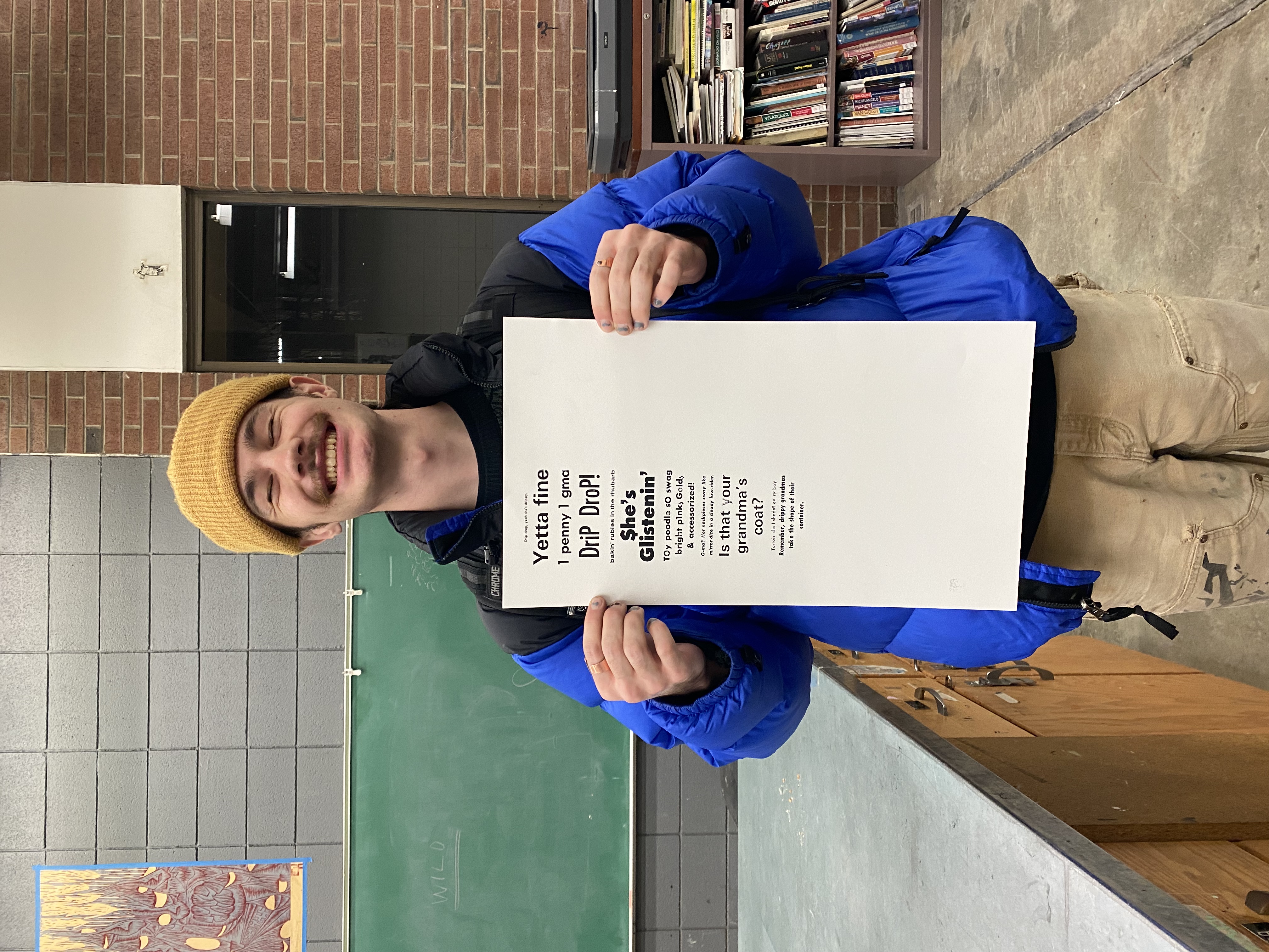 A workshop participant holding up a printed page